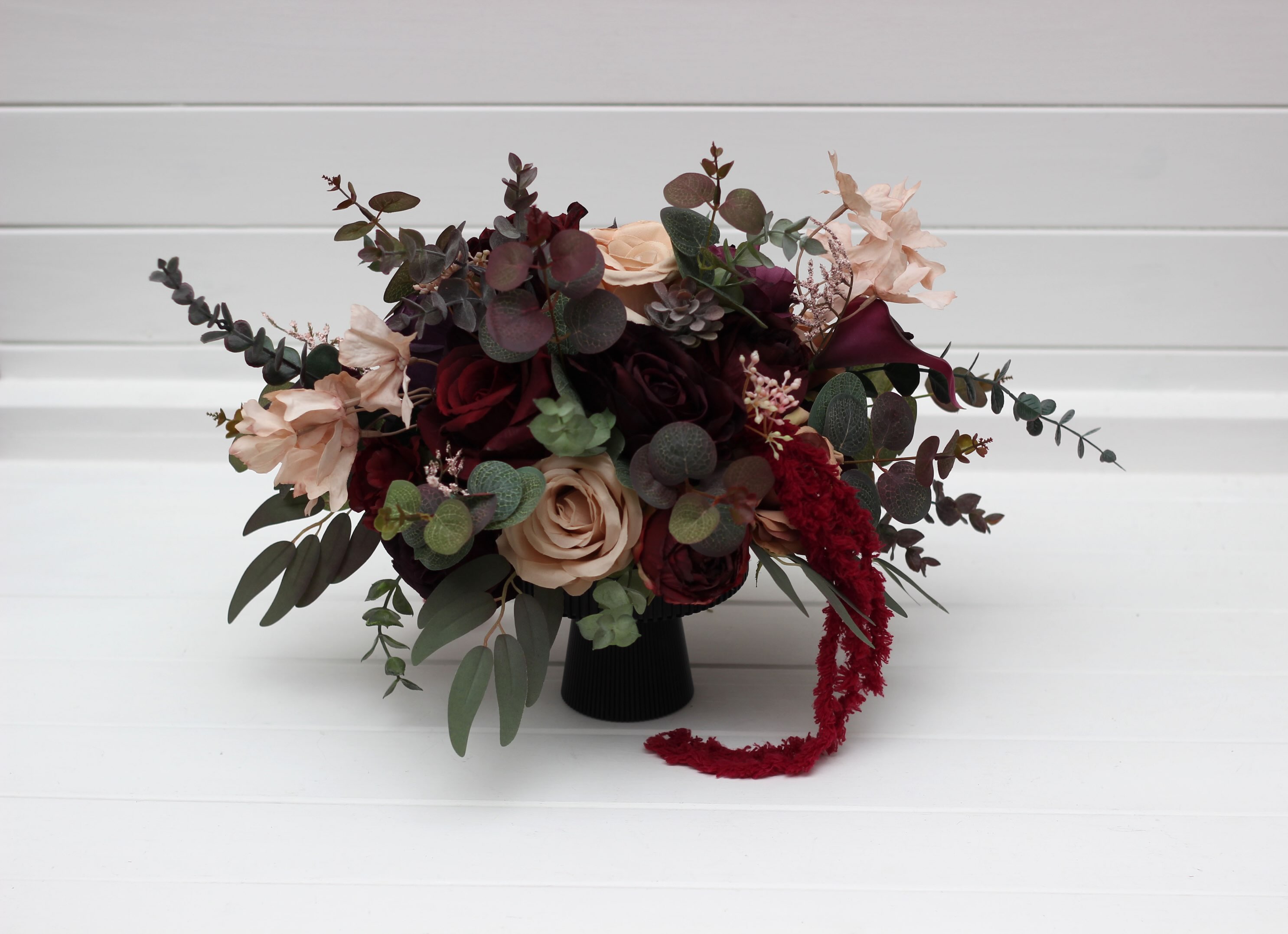 Elevate your wedding or event tables with these breathtaking burgundy and blush centerpieces. A sophisticated blend of d