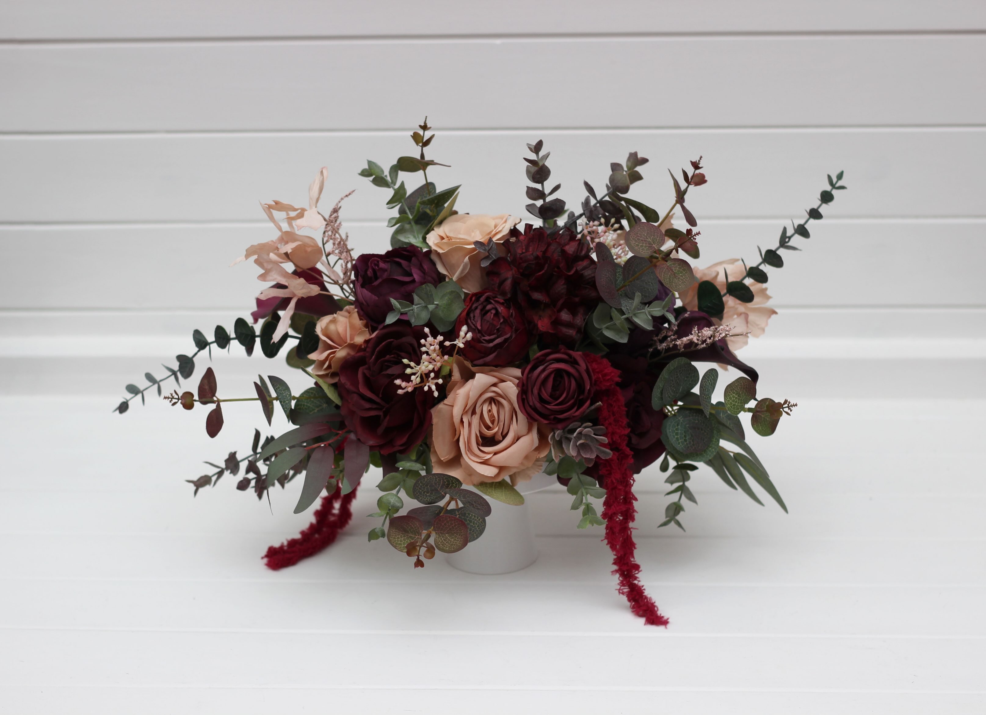 Elevate your wedding or event tables with these breathtaking burgundy and blush centerpieces. A sophisticated blend of d