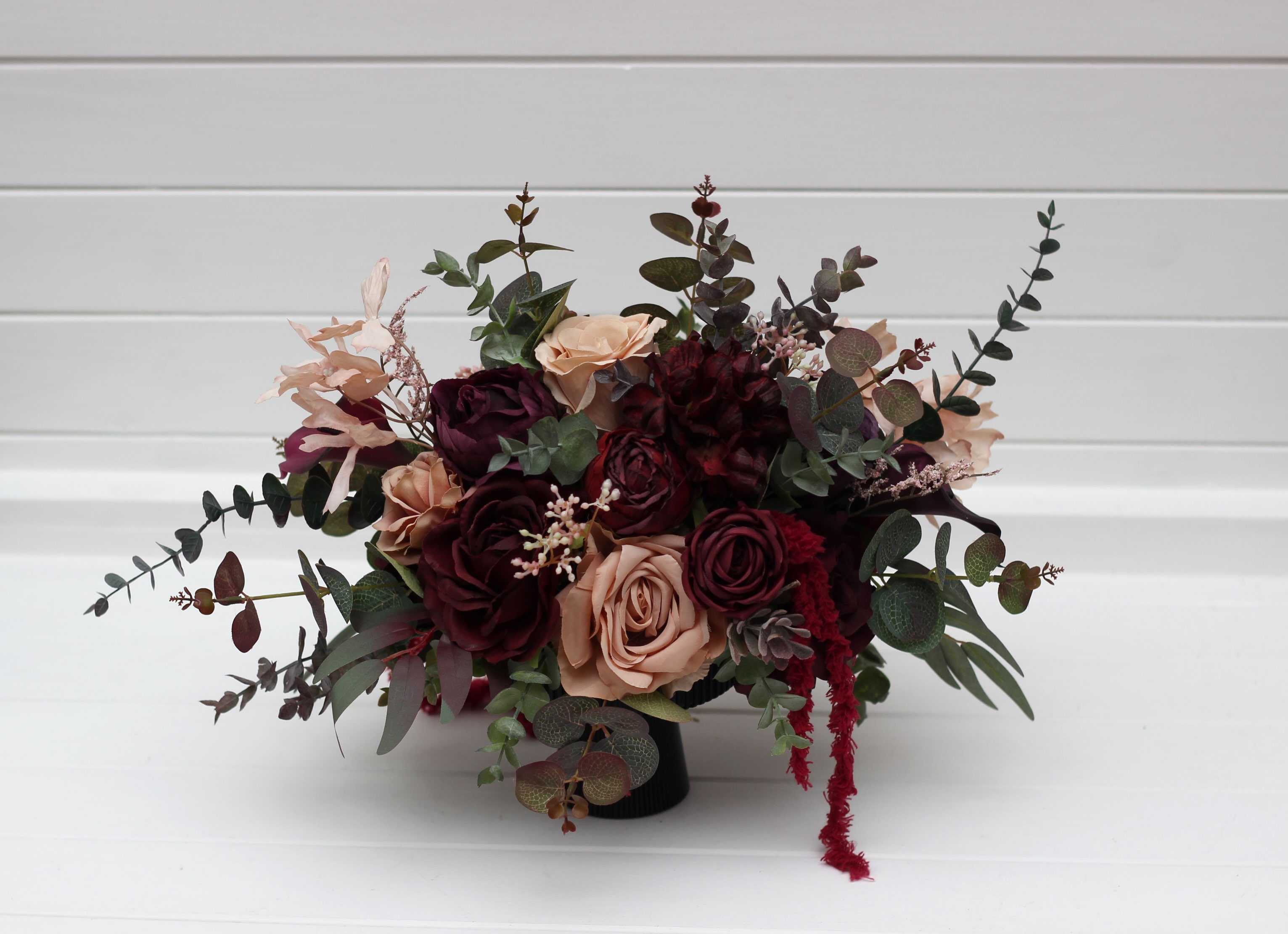 Elevate your wedding or event tables with these breathtaking burgundy and blush centerpieces. A sophisticated blend of d
