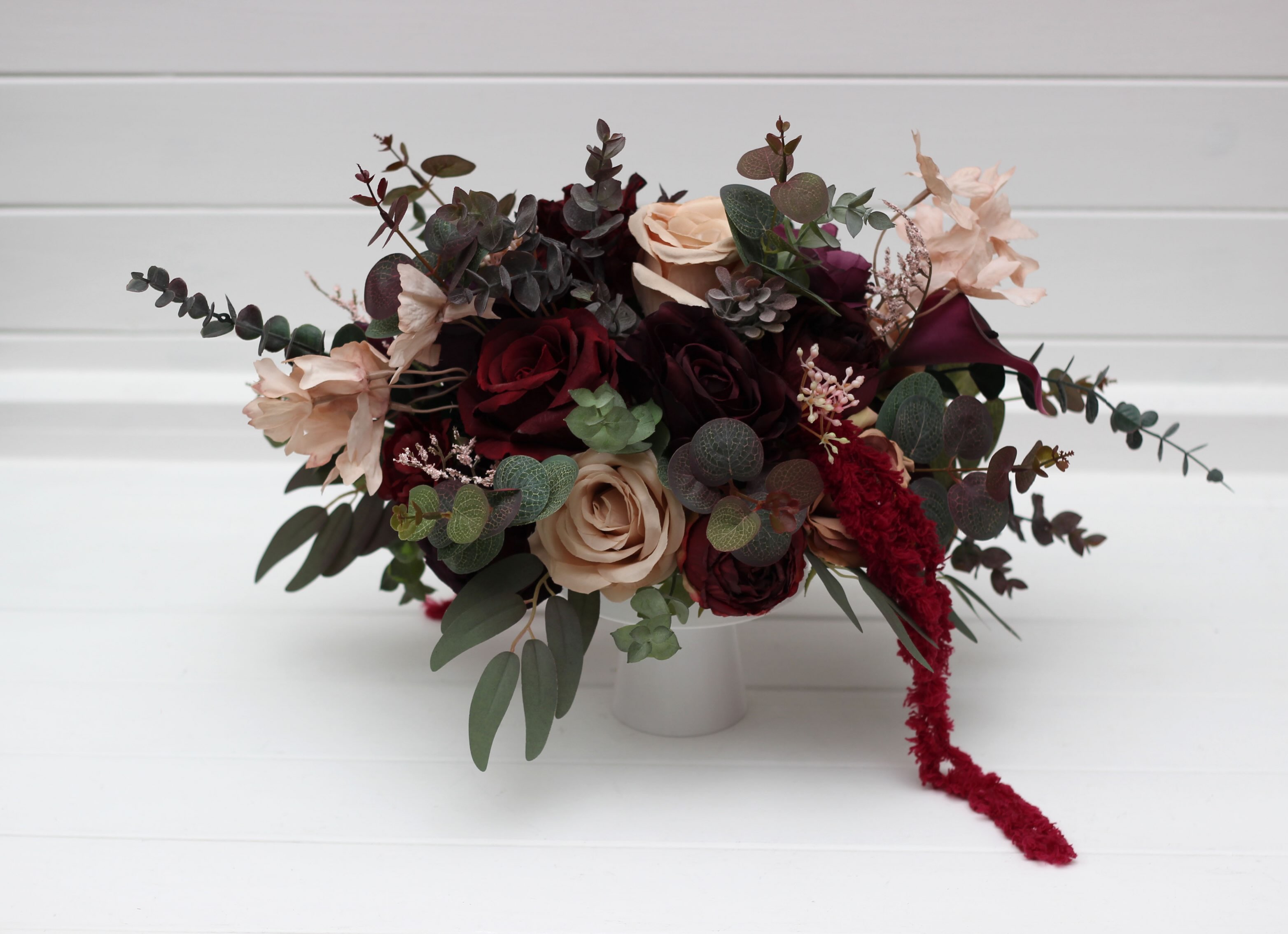 Elevate your wedding or event tables with these breathtaking burgundy and blush centerpieces. A sophisticated blend of d
