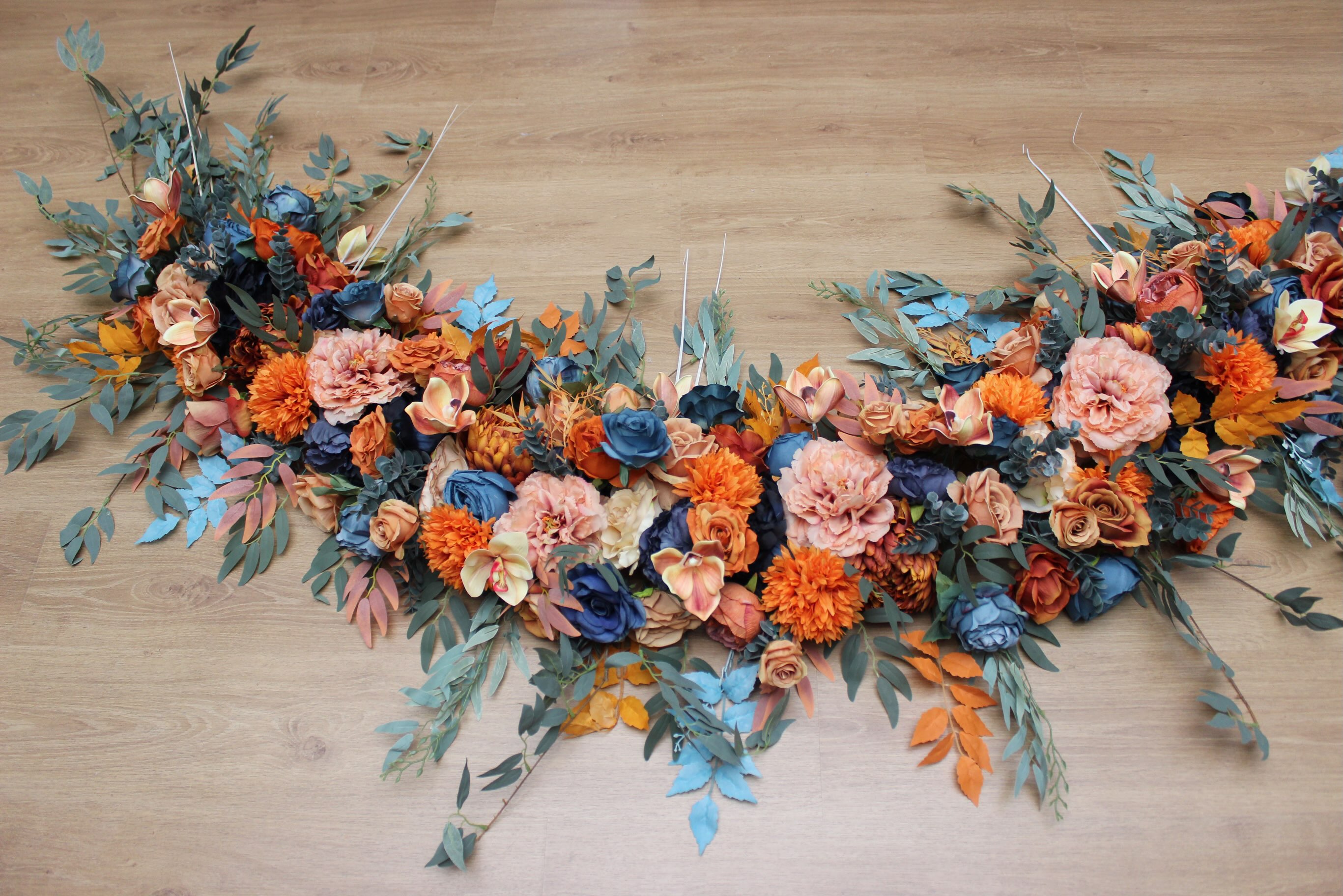 Stretching nearly 17 feet (5 meters) in length, this custom floral arch was designed to create a bold and unforgettable 
