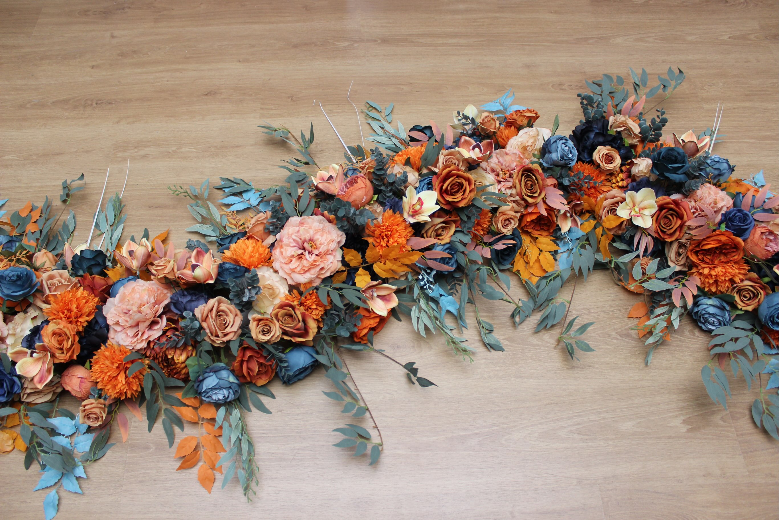 Stretching nearly 17 feet (5 meters) in length, this custom floral arch was designed to create a bold and unforgettable 